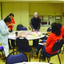 The Site Organizing team (Natasha Frost, Yoli Banda, Rachel Stillwell and Alfredo Vargas) discuss their plans to collect signatures and ideas from co-workers and to present their poster to district leadership, demonstrating their solidarity behind a this critical issue.